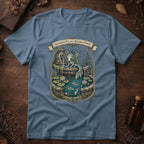 Steel blue t-shirt with an ornate illustration of a pale blue water dragon spirit resting on a moss-covered stone fountain among lily pads and koi.