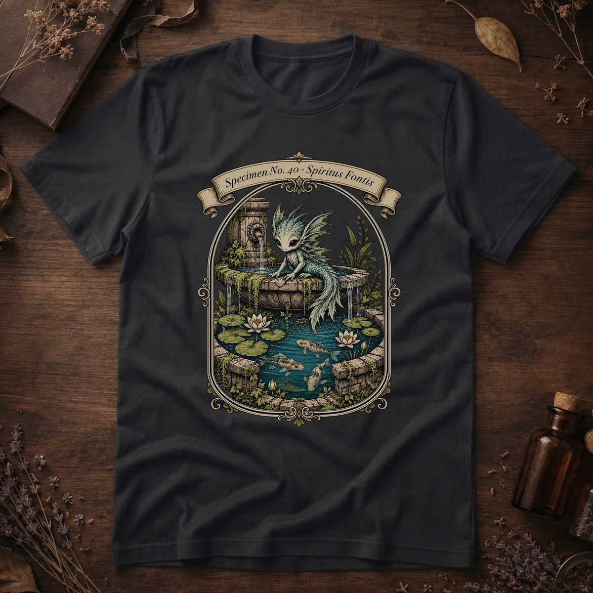 Black t-shirt with an ornate illustration of a pale blue water dragon spirit resting on a moss-covered stone fountain among lily pads and koi.