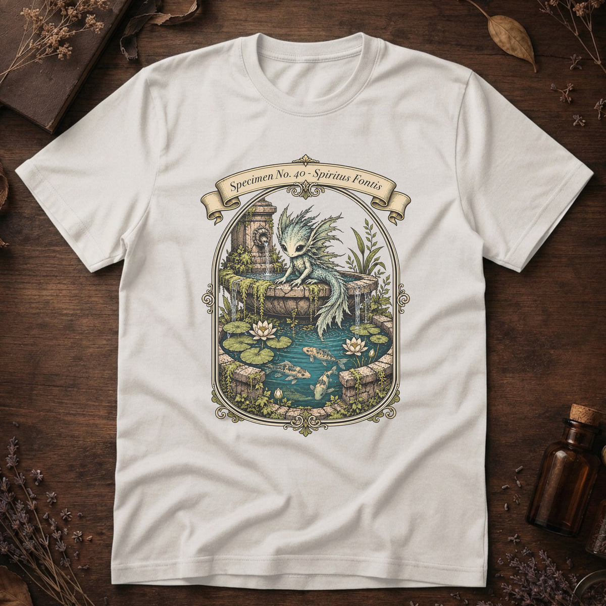 Vintage white t-shirt with an ornate illustration of a pale blue water dragon spirit resting on a moss-covered stone fountain among lily pads and koi.