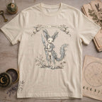 Vintage white t-shirt with a vintage illustration of a winged rabbit-like frost spirit holding a spear, surrounded by botanical linework and a Specimen No. 31 banner.