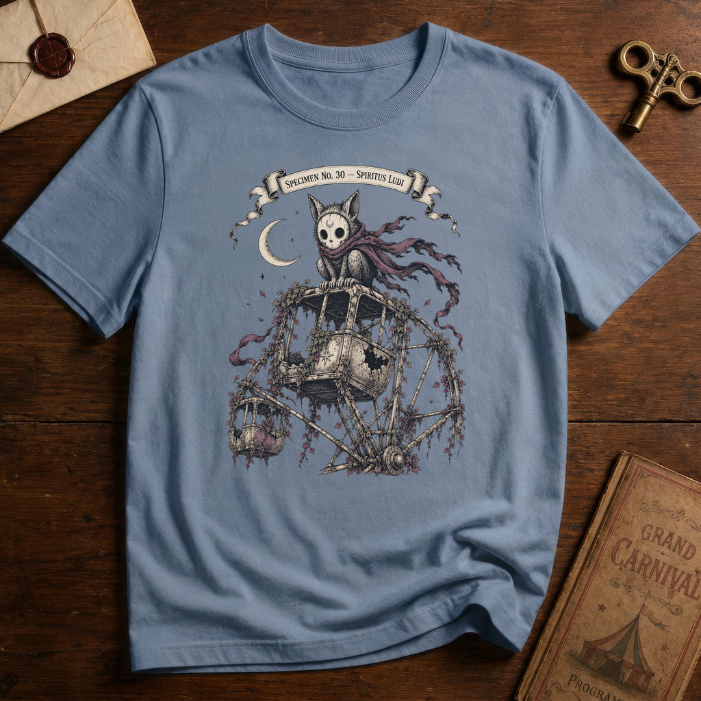 Steel blue t-shirt with a gothic illustration of a skeletal cat spirit with a flowing scarf riding an old mechanical ferris wheel beneath a crescent moon.